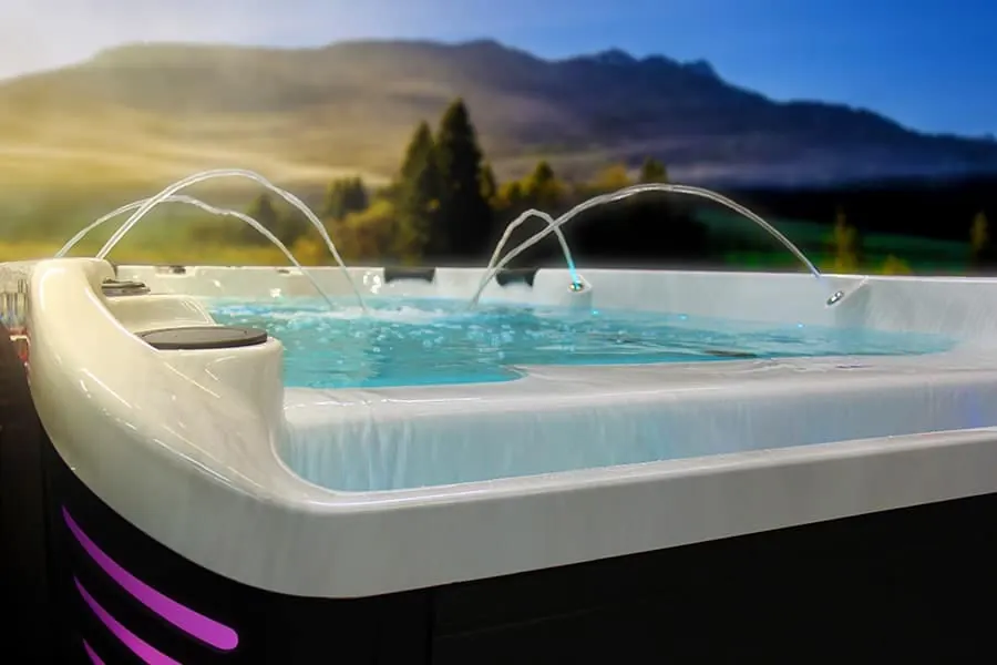 A swim spa with the jets running, set into a terrace
